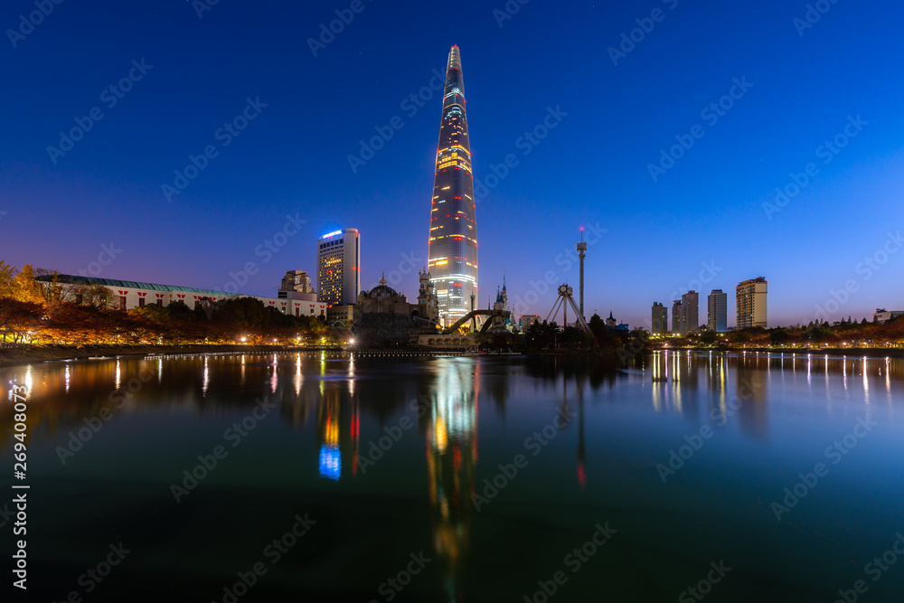 Twilight sunset at Seokchon Lake with city in Seoul ,South Korea. Twilight sunset at Seokchon Lake with city in Seoul ,South Korea.