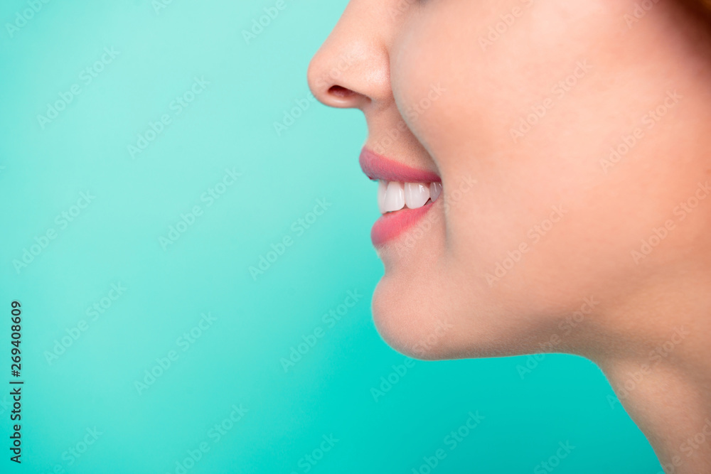 Obraz premium Cropped close-up profile side view portrait of her she nice adorable perfect healthy white cheerful cheery wavy-haired girl hygiene isolated over bright vivid shine blue background