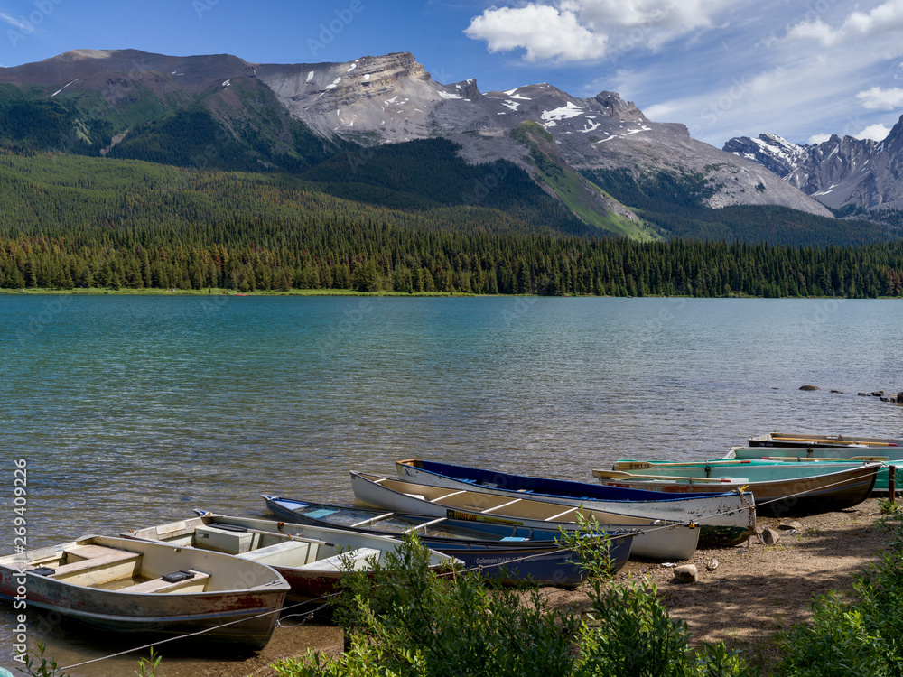 Boats at lakeside, Maligne Lake, Maligne Canyon, Jasper National Park, Jasper, Alberta, Canada