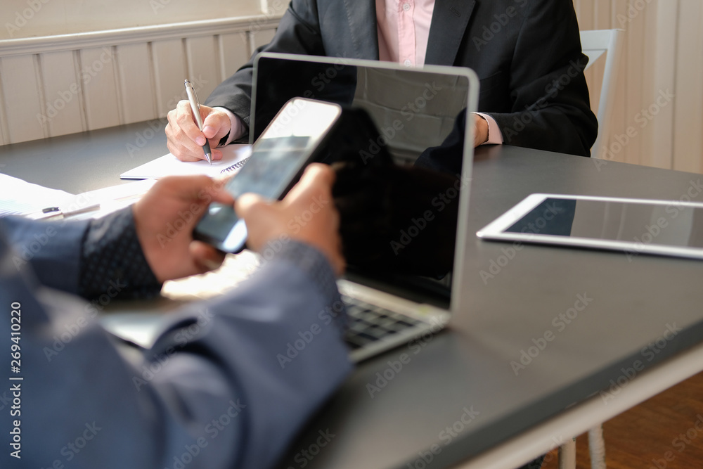 business people working with document smartphone business people working with document smartphone