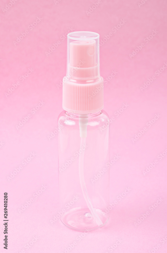 Clear pink plastic bottle spray. Clear pink plastic bottle spray.
