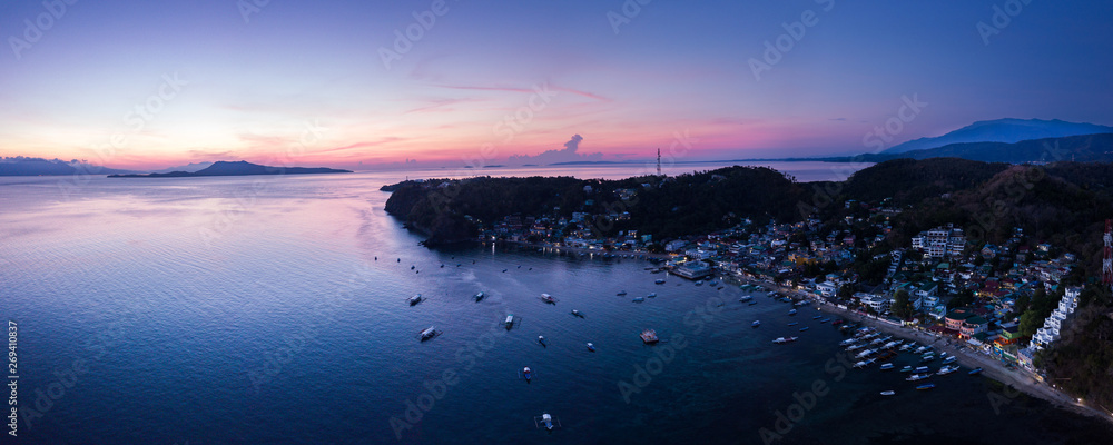 Panorama Aerial Drone Picture of the Sunrise and Boats in Sabang, Puerto Galera, Philippines Panorama Aerial Drone Picture of the Sunrise and Boats in Sabang, Puerto Galera, Philippines