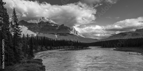 River flowing through landscape with mountains in the background, Icefields Parkway, Improvement District 9, Banff National Park, Jasper, Alberta, Canada