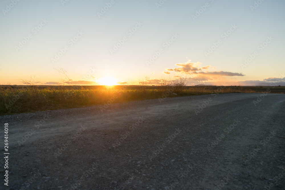 sunset at a path with clear sky
