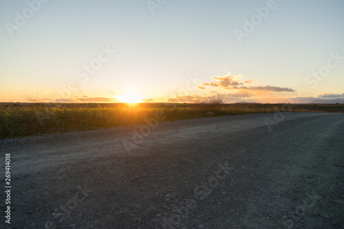 sunset at a path with clear sky