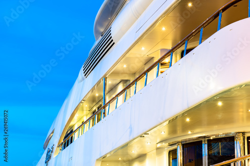 Luxury yachts docked in sea port at sunset