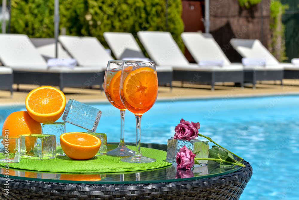two summer cocktails near the water pool