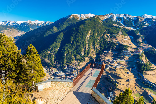 High angle viewpoint overlooking a valley in Andorra on sunny winterday in december. Andorra is a sovereign landlocked microstate on the Iberian Peninsula in the eastern Pyrenees