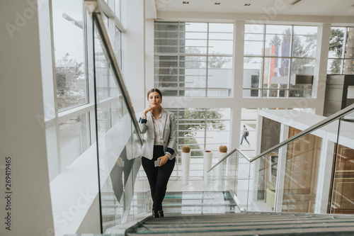 Young business woman stands...