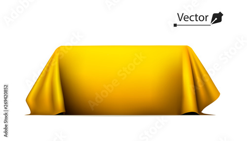 Object covered with golden silk cloth. Empty podium or presentation. Gold, secret box, hidden under satin fabric with drapery.