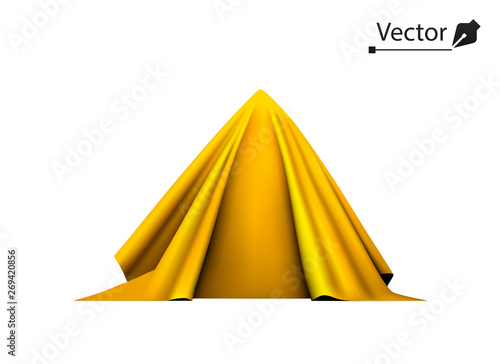 Object covered with golden silk cloth. Gold, pyramid, triangle hidden under satin fabric.