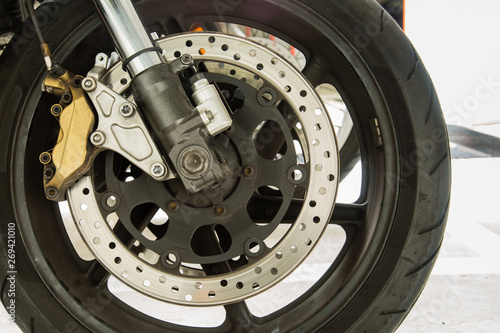 metal motorbike front wheel closeup view