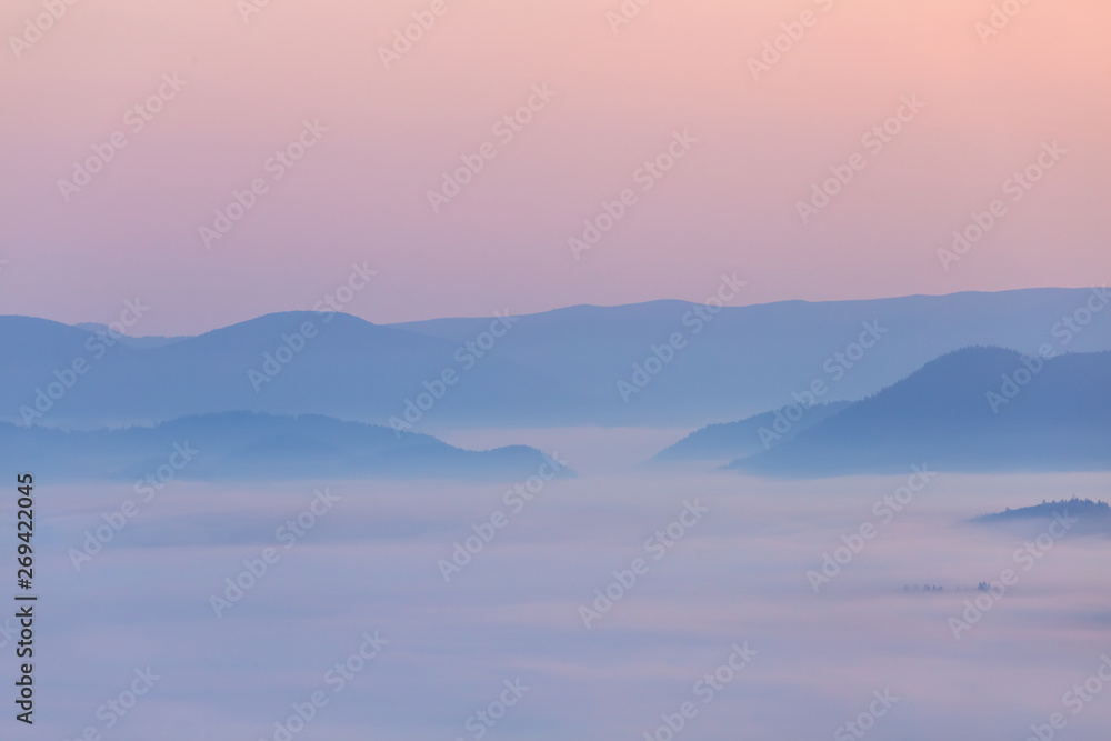 mountain silhouette in the blue mist, early morning scene, good natural background