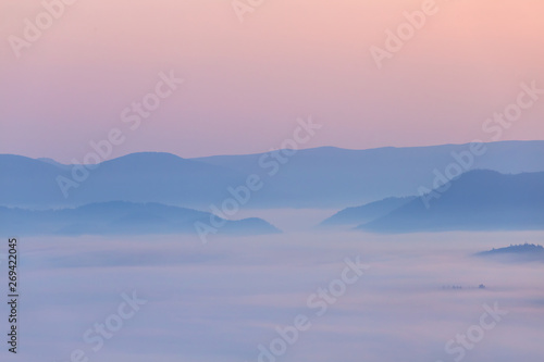 mountain silhouette in the blue mist, early morning scene, good natural background
