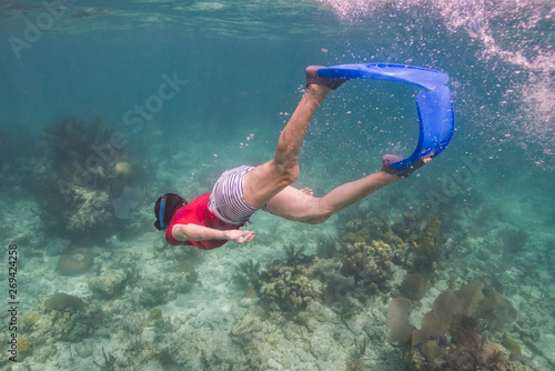 Woman snorkeling, Turneffe Atoll, Belize Barrier Reef, Belize