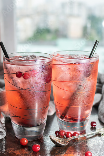 Two glasses of iced cranberry tea. Summer fresh drink.