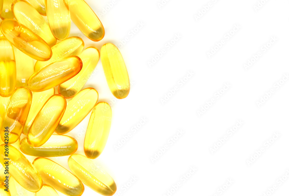 Close up of capsules Omega 3 on white background. Copy space for your text. Top view, high resolution product. Close up of capsules Omega 3 on white background. Copy space for your text. Top view, high resolution product.