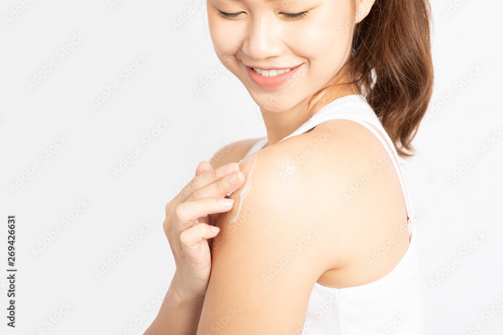 Close up beautiful woman with cream lotion apply on her shoulder feeling so happiness and cheerful for .Moisture her healthy skin,Skincare Concept Close up beautiful woman with cream lotion apply on her shoulder feeling so happiness and cheerful for .Moisture her healthy skin,Skincare Concept