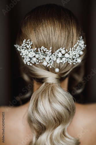Elegant bride hairstyle. Bridal accessory, bridal hairstyle. Look from back