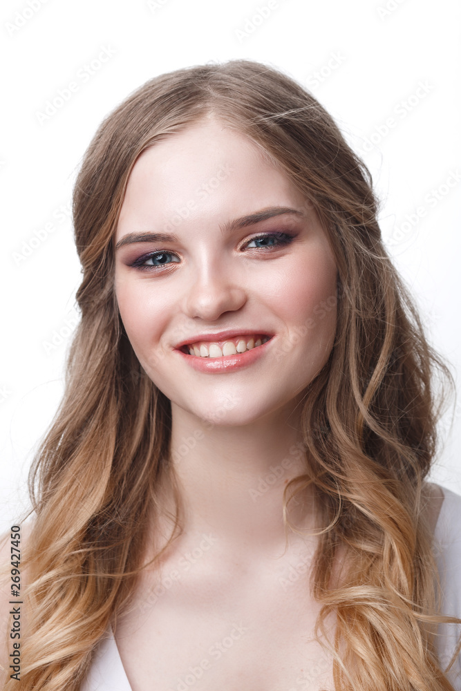 close-up of a positive young woman bride with professional wedding makeup pastel colors and hair styling curls. close-up of a positive young woman bride with professional wedding makeup pastel colors and hair styling curls.