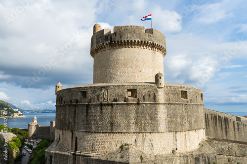 Minceta Tower at sanset lights and Dubrovnik medieval old town city walls, Croatia photo