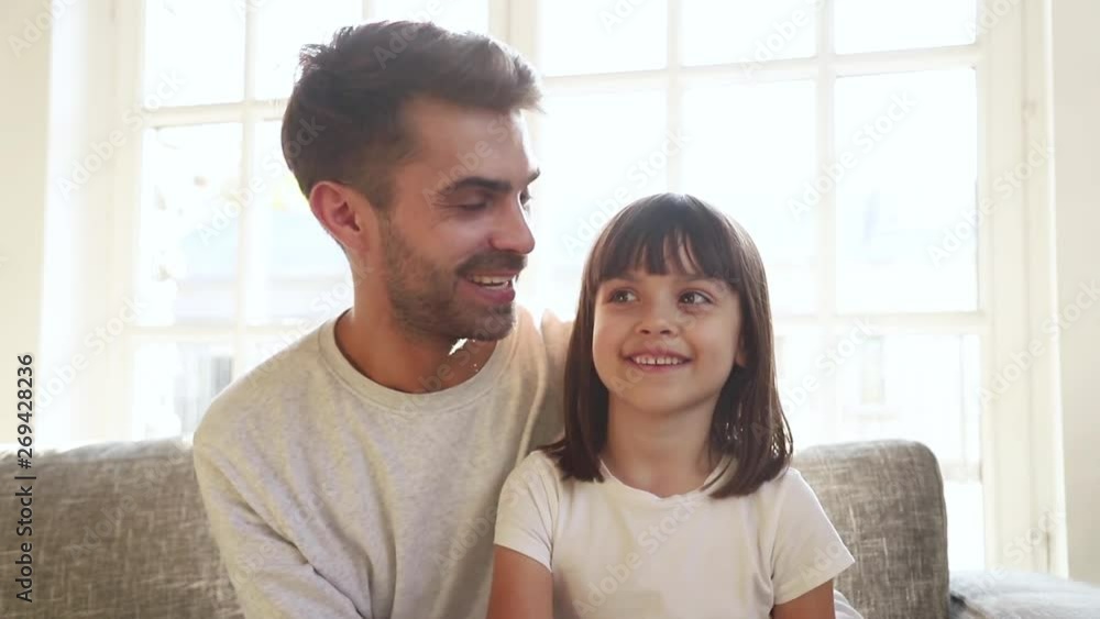 Happy little child girl and dad waving hands recording vlog Happy little child girl and dad waving hands recording vlog