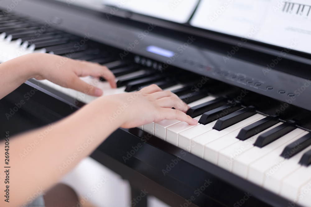 Young boy playing on a digital piano Young boy playing on a digital piano