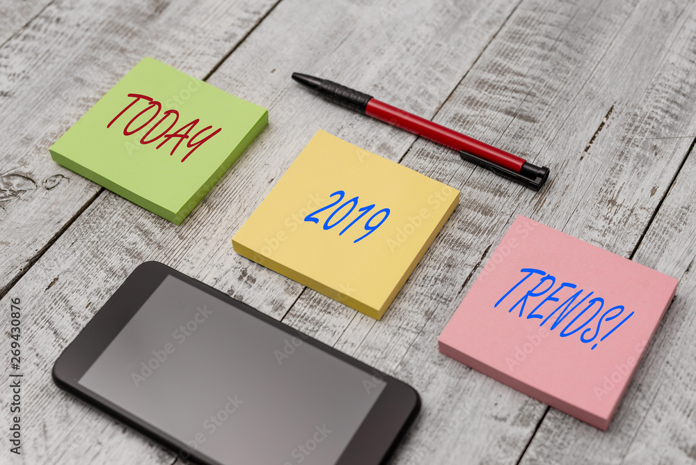 Word writing text 2019 Trends. Business photo showcasing general direction in which something is developing or changing Stationary writing equipment and phone with paper sheets on the wooden desk Word writing text 2019 Trends. Business photo showcasing general direction in which something is developing or changing Stationary writing equipment and phone with paper sheets on the wooden desk