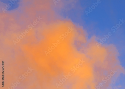 dense orange smoke on blue sky
