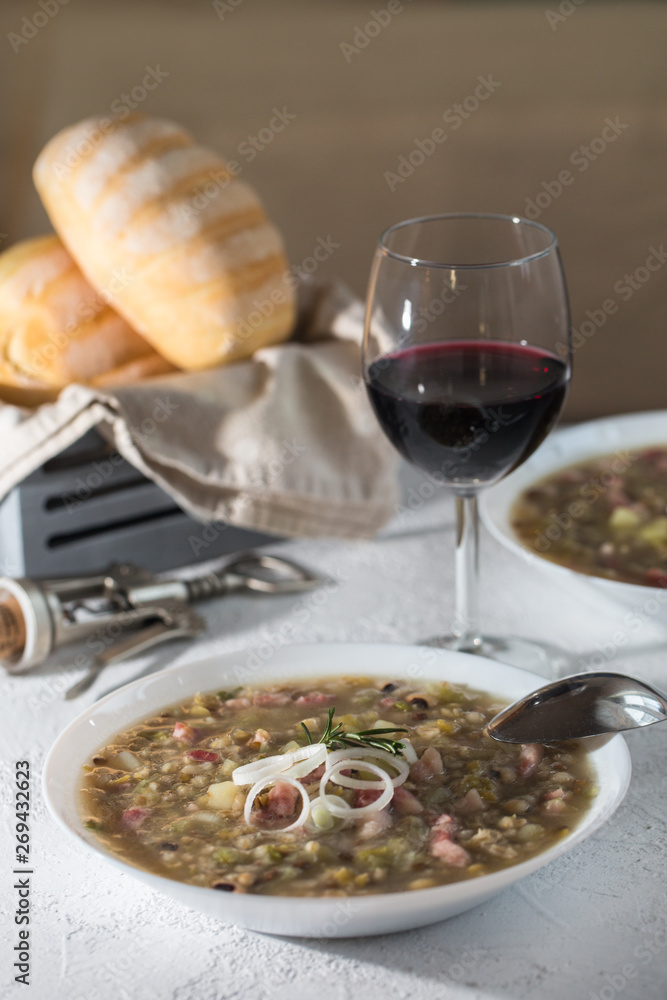 Rustic bean and farro soup with pancetta, onion and celery. Italian food. Rustic bean and farro soup with pancetta, onion and celery. Italian food.