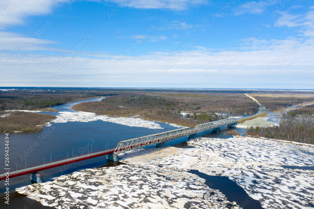View from the height of the bridge over the river Nadym during the ice drift in Northern Siberia View from the height of the bridge over the river Nadym during the ice drift in Northern Siberia