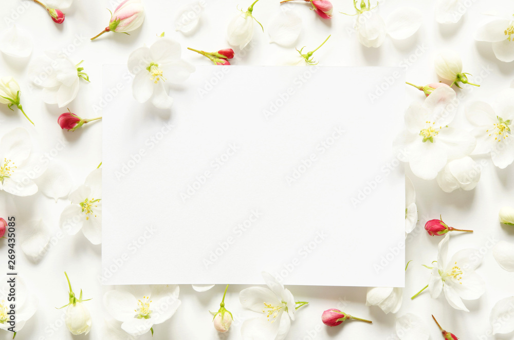 Creative layout of summer fresh flowers with space for text on white paper. Mockup. View from above. - Image