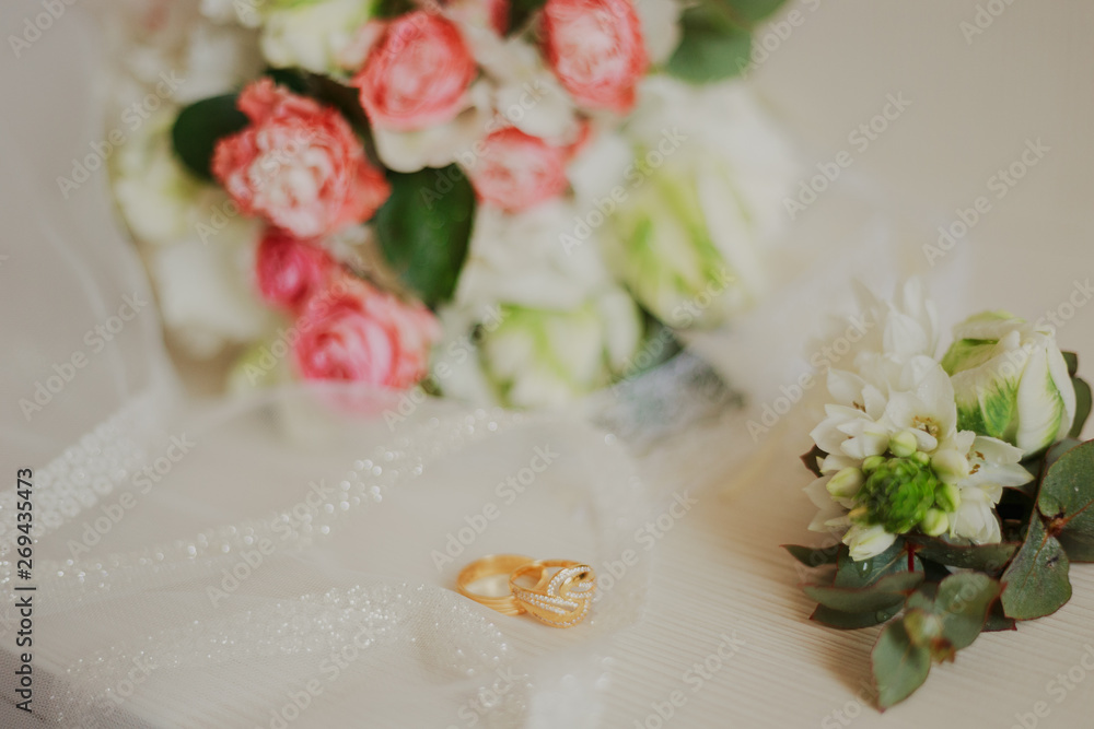 Beautiful modern wedding bouquet on a white table. Wedding attributes. No people Beautiful modern wedding bouquet on a white table. Wedding attributes. No people