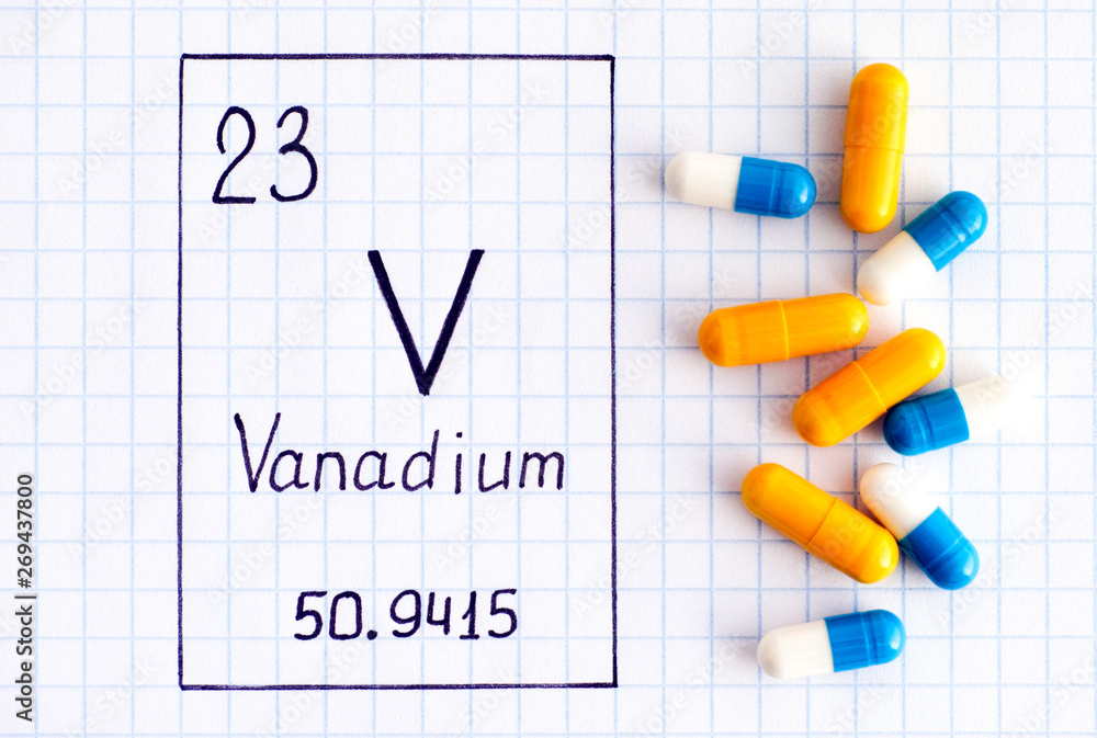 Handwriting chemical element Vanadium V with some pills. Handwriting chemical element Vanadium V with some pills.