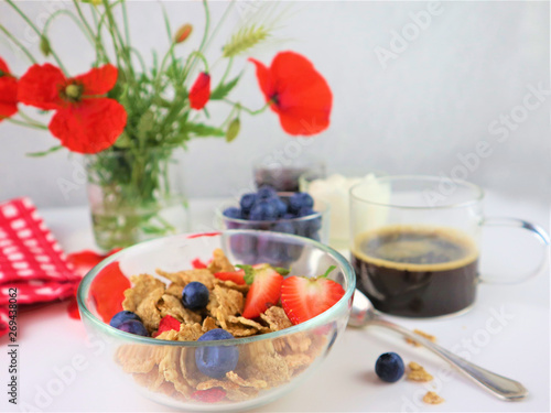 Breakfast served with coffee  cereals and fruits.