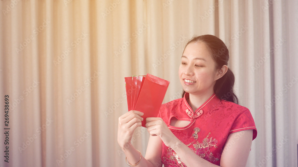 Asian woman happy face chinese new year red traditional costime Asian woman happy face chinese new year red traditional costime
