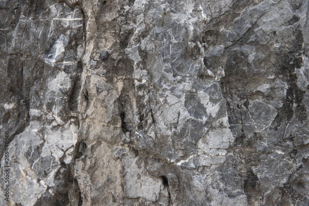 Cracked stone texture background. Distressed natural surface. Ecologic design template. Volcanic rock cracked surface