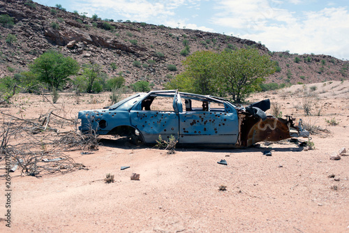 A wrecked junk car in the desert in Africa