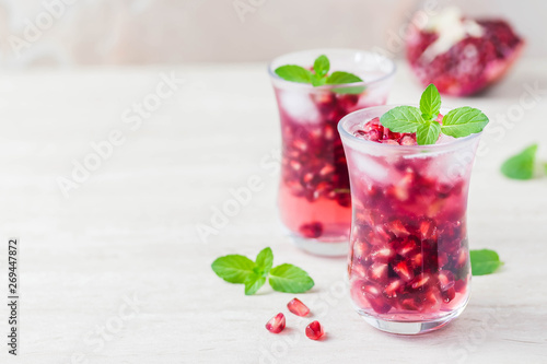 Pomegranate green tea cocktail. Selective focus, space for text.