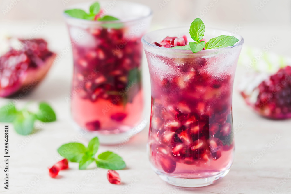 Pomegranate green tea mojito . Selective focus, space for text. Pomegranate green tea mojito . Selective focus, space for text.