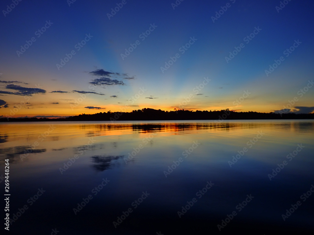 Obraz premium Sunset over an Amazonian lagoon