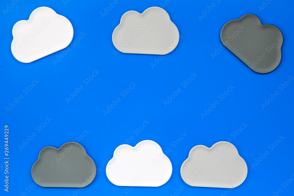 Clouds figures for cloud storage on blue background top view mockup