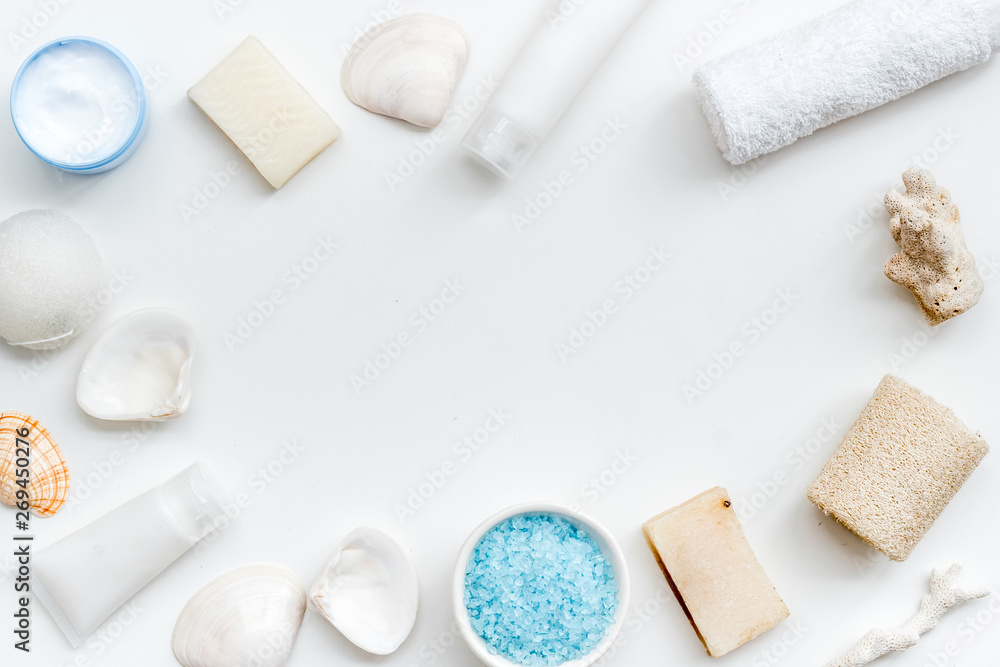 organic cosmetic frame with Dead Sea salt, cream and lotion on white background top view mock up organic cosmetic frame with Dead Sea salt, cream and lotion on white background top view mock up