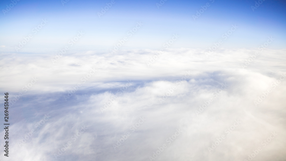 The beautiful cloudscape with clear blue sky. A view from airplane window. The beautiful cloudscape with clear blue sky. A view from airplane window.
