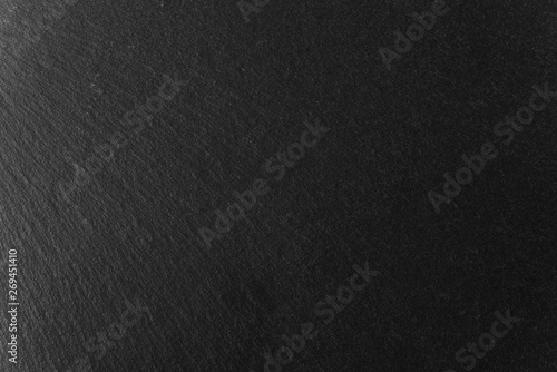 Abstract background of black slate stone texture and pattern 
