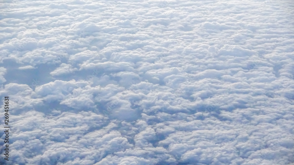 The beautiful cloudscape with clear blue sky. A view from airplane window. The beautiful cloudscape with clear blue sky. A view from airplane window.