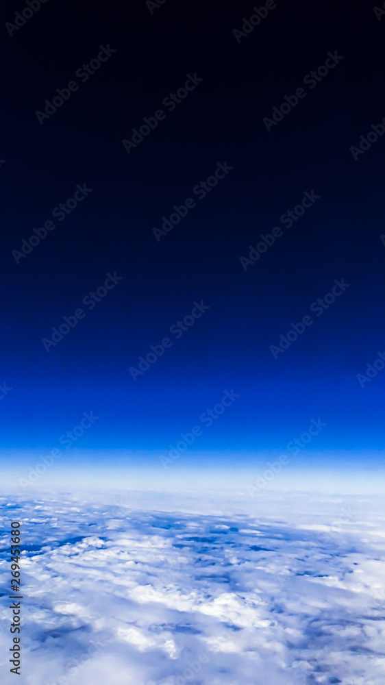 Wonderful view of cloudscape with clear blue sky from above.