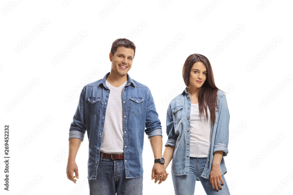 Fototapeta premium Casual young couple holding hands