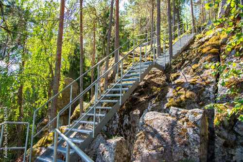 View of Devil's Church (Pirunkirkko) area and stairway, rocks, trees and stairway, Koli, North Karelia, Finland photo