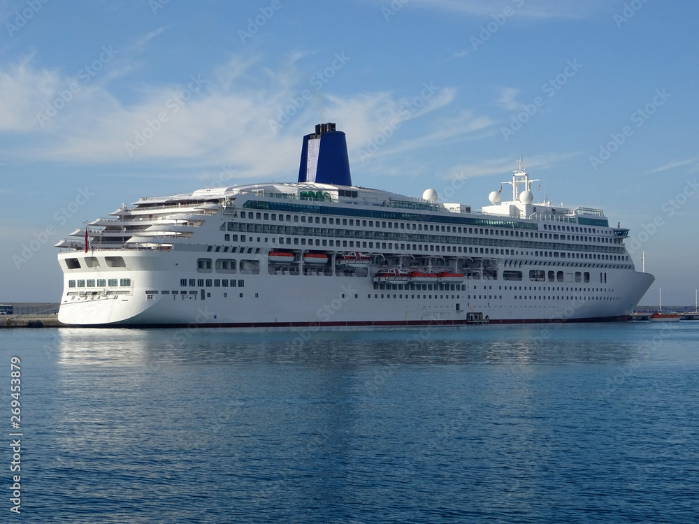 panoramic view of a cruise ship docked at the harbor